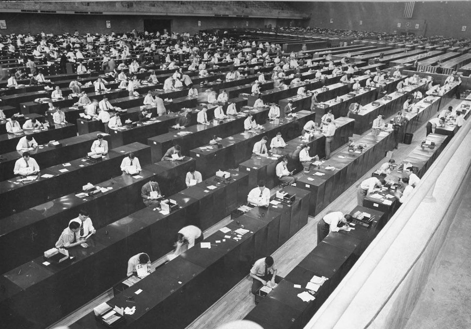 Rows of clerks at desks in the FBI fingerprint warehouse